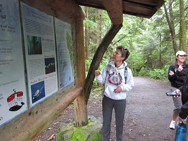 Carol Bernthal standing infront of a map of Cape Flattery