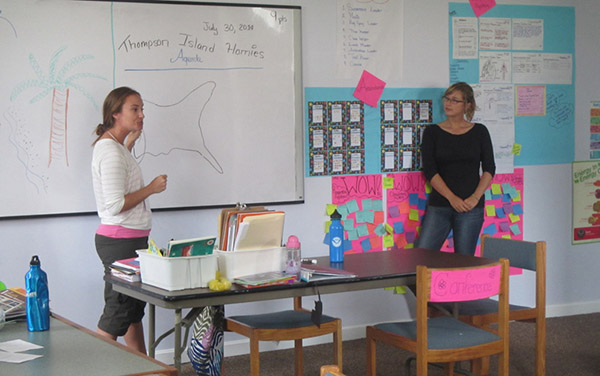 photo of scholars in a classroom teaching