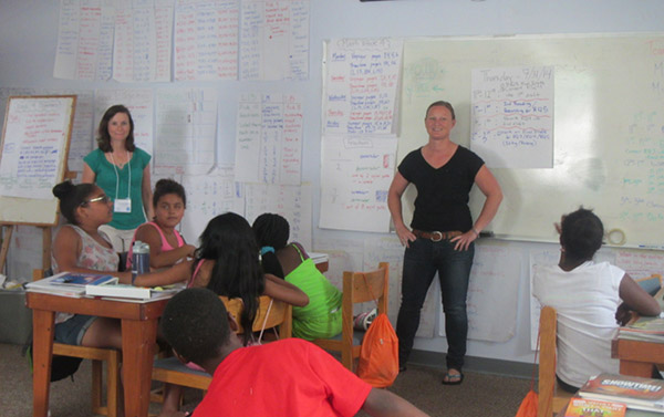 photo of scholars in a classroom practicing teaching