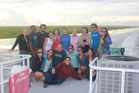 group photo on the back of a boat